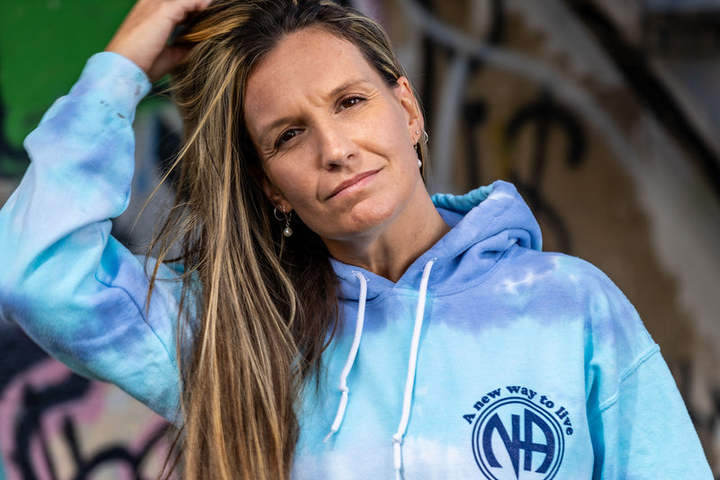 Load image into Gallery viewer, blue tie-dye hoodie with a logo and text
