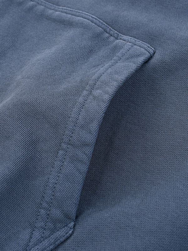 Load image into Gallery viewer, Close-up of a blue fabric texture with stitching detail