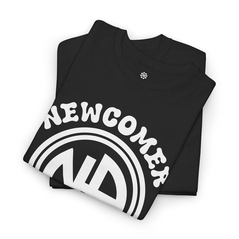 Load image into Gallery viewer, Black t-shirt with 'NEWCOMER' text and logo on a white background