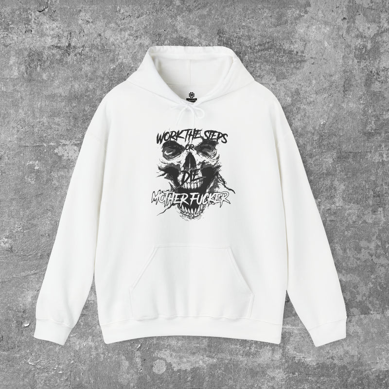 Load image into Gallery viewer, Gray background behind a folded white hooded hoodie/sweatshirt with a black screaming skeleton skull face with text on top that says "WORK THE STEPS OR DIE MOTHERFUCKER" and has a large singular front pocket in the middle.