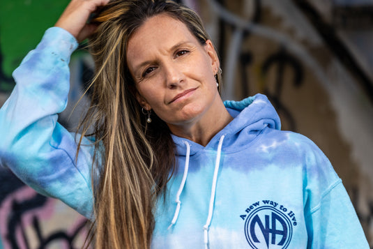 blue tie-dye hoodie with a logo and text