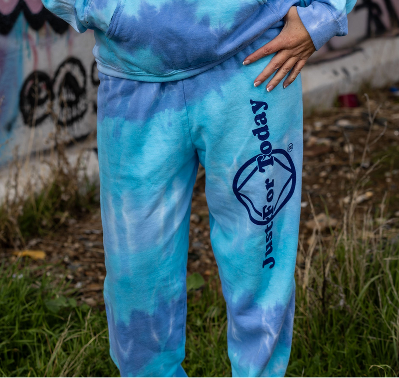 Load image into Gallery viewer, blue tie-dye sweatpants with 'Just for Today' logo
