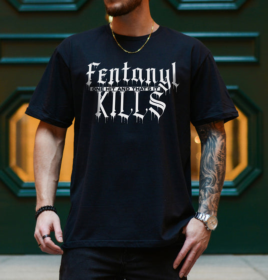 Person wearing a black t-shirt with 'Fentanyl Kills' text in white.