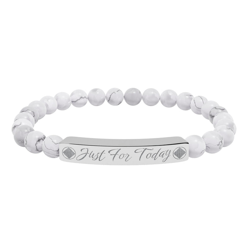 Load image into Gallery viewer, White beaded bracelet with an engraved tag on a white background
