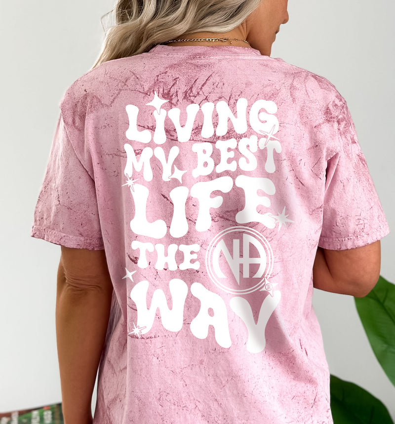 Load image into Gallery viewer, Pink t-shirt with 'Living My Best Life The Way' text on the back, worn by a person.
