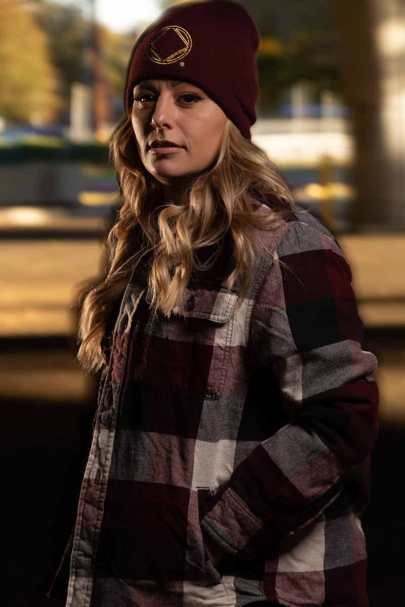 Load image into Gallery viewer, plaid jacket with a visible NA logo
