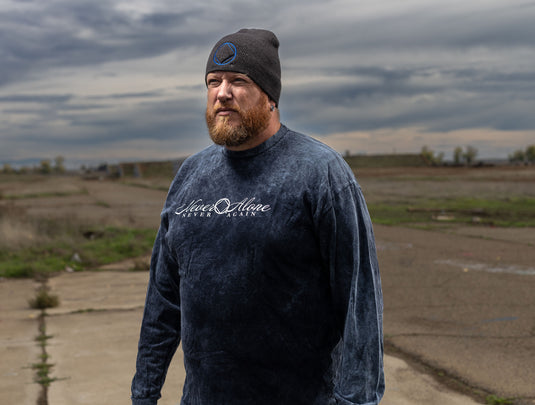 dark blue sweatshirt with a logo