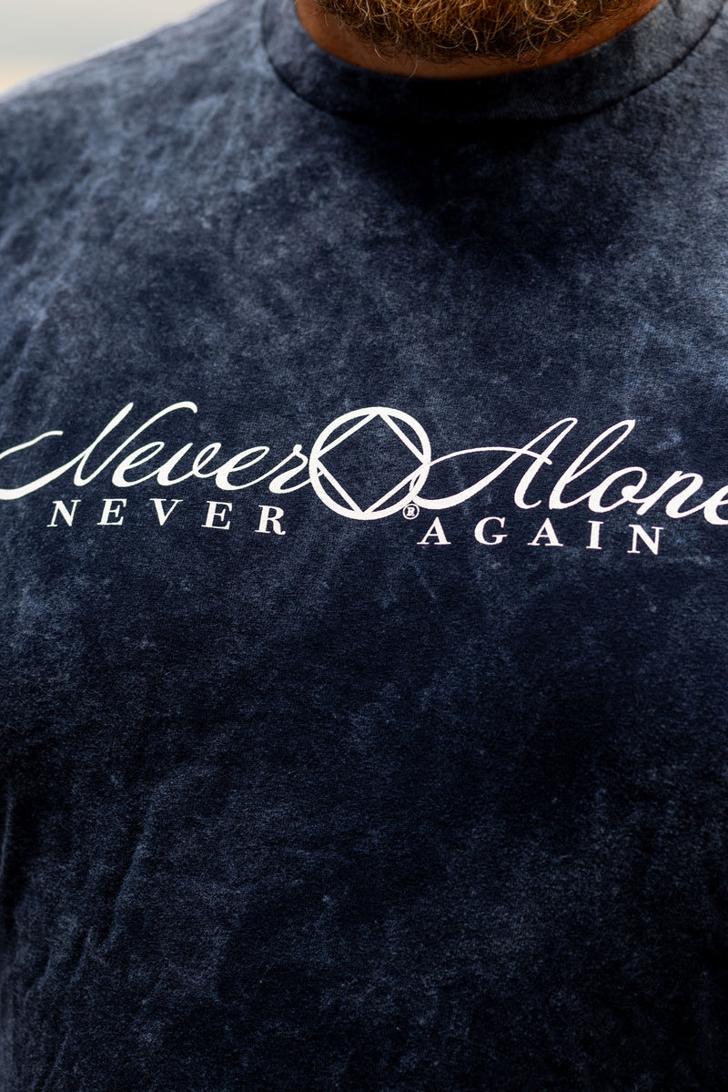 Load image into Gallery viewer, Navy blue shirt with 'Never Alone, Never Again' text
