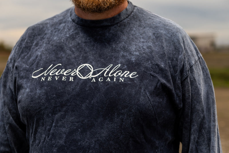 Load image into Gallery viewer, dark blue shirt with 'Never Alone Never Again' text.
