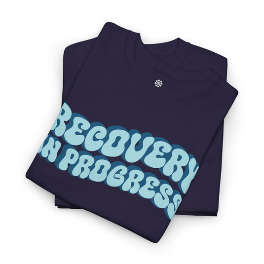 Navy blue t-shirt with 'RECOVERY IN PROGRESS' text in light blue on a white background
