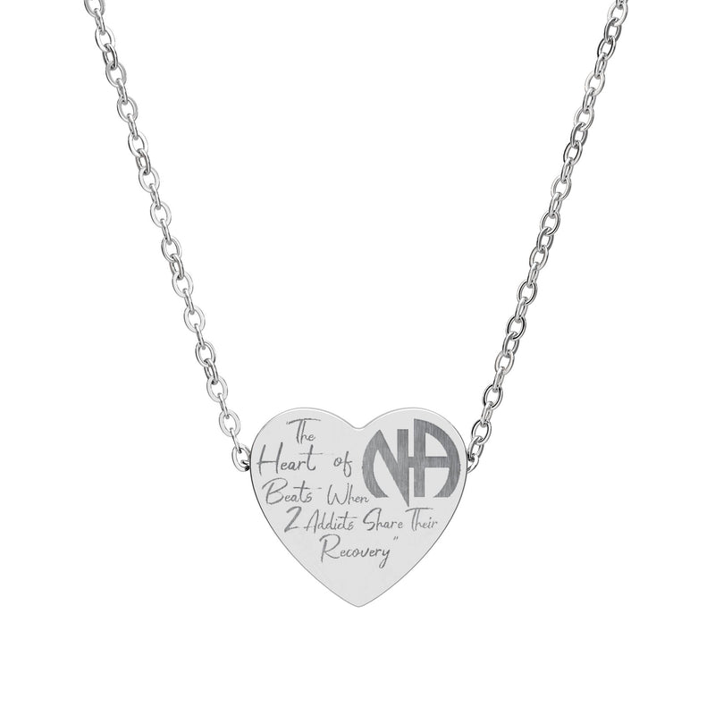 Load image into Gallery viewer, Silver necklace with a heart-shaped pendant on a white background
