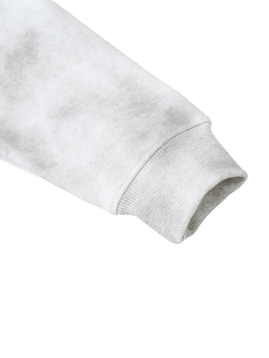 Close-up of a gray sweatshirt sleeve on a white background