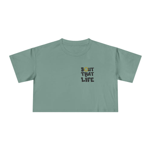 Green t-shirt with 'Bout That Life' text