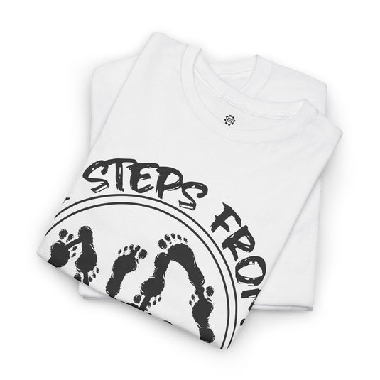 Folded white shirt with 'Steps From' text and footprints on a white background