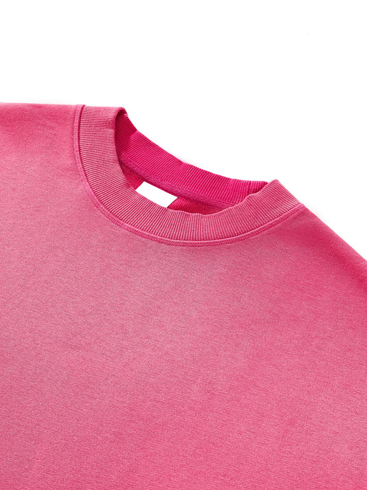 Close-up of a pink sweatshirt collar on a white background