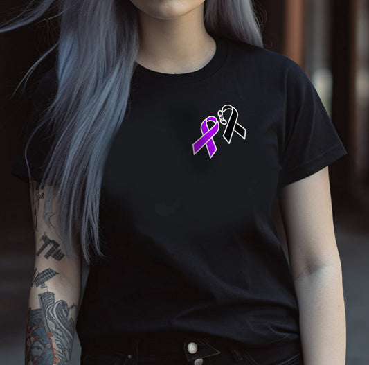 Background of a blurred hallway behind a girl with a tattoo and silver hair wearing a black crew neck tee shirt with black and purple fentanyl awareness ribbons in the upper corner on her left side