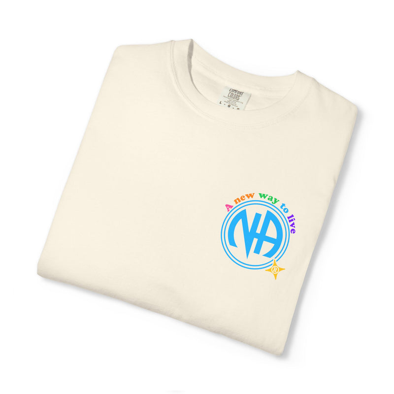Load image into Gallery viewer, Folded cream-colored t-shirt with colorful logo and text on a white background
