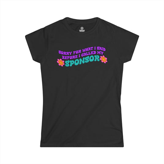 Black t-shirt with colorful text and flowers on a white background